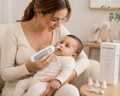 Aspirador nasal eléctrico para bebé - mamá usando el producto